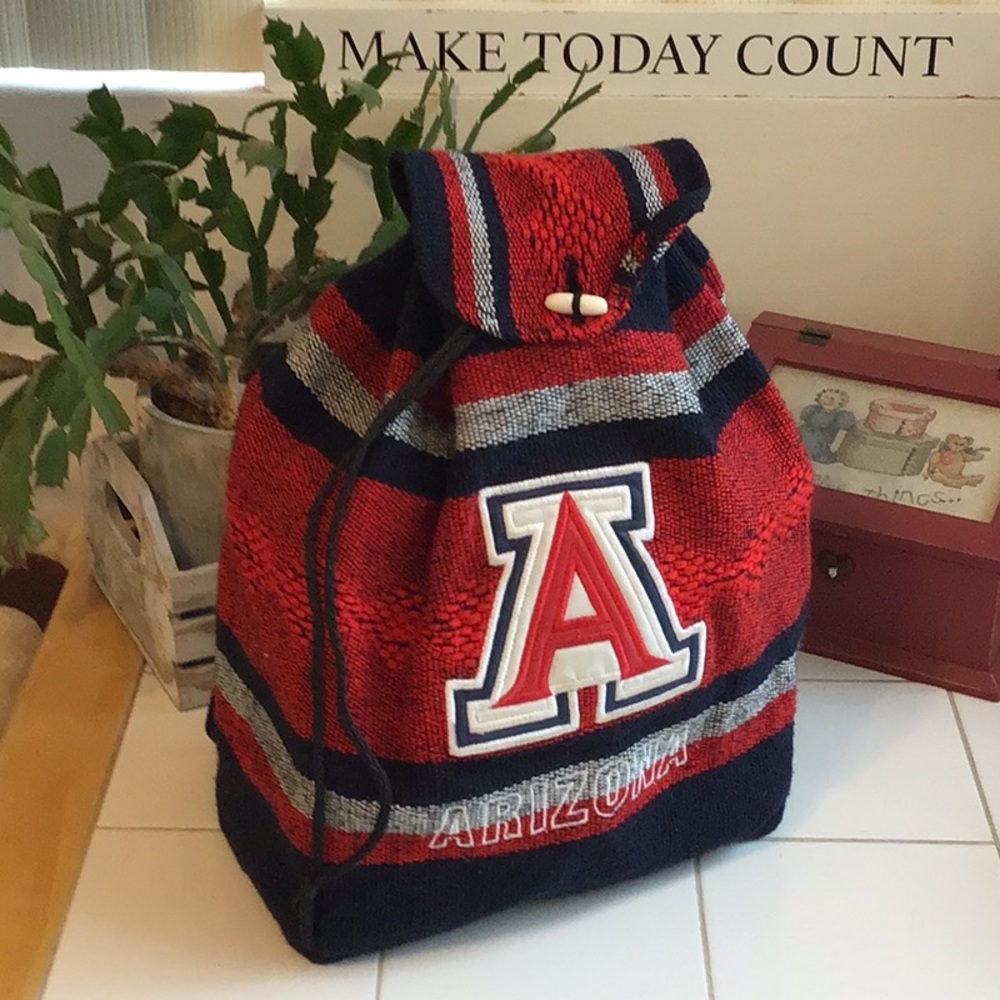 ‘Uofa’ Tapestry Drawstring Backpack - image 1